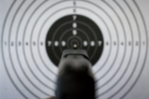handgun pointed at a target