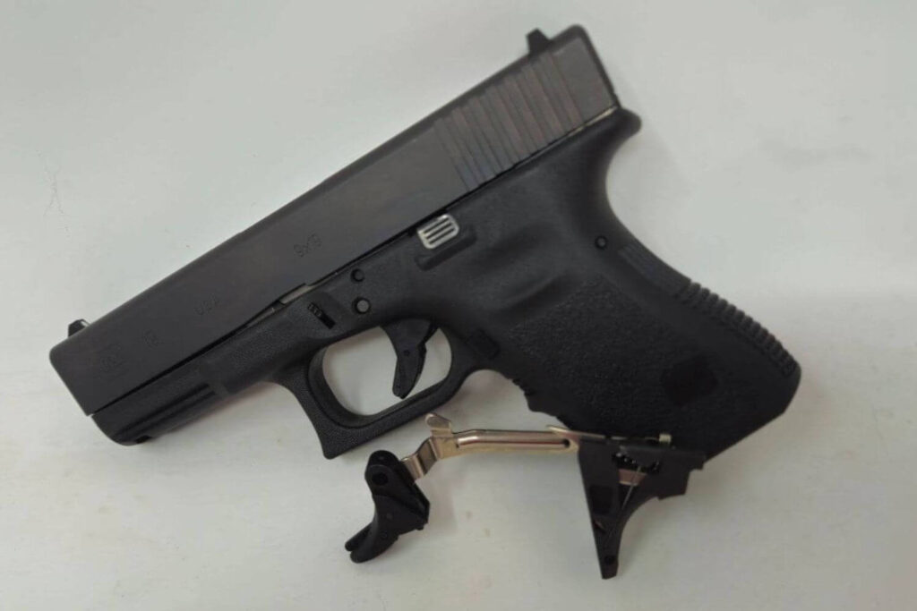 PR Triggers Model G components next to a custom pistol