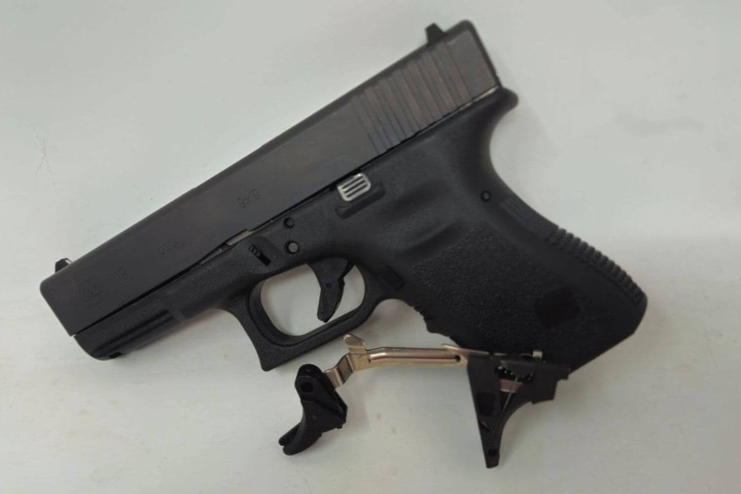 PR Triggers Model G components next to a custom pistol