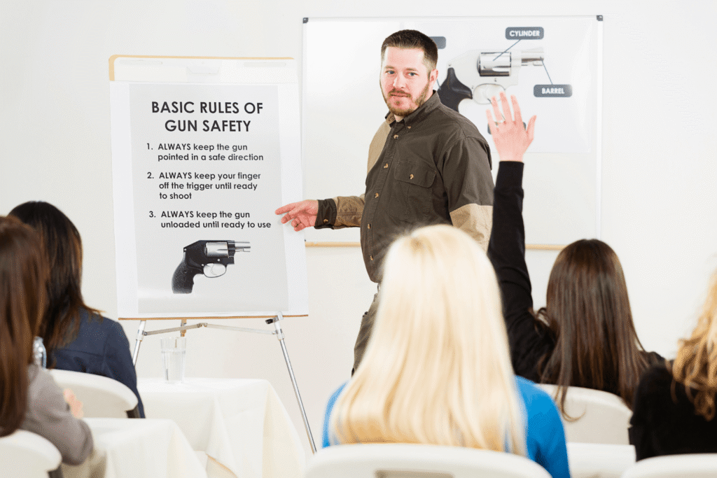 Man teaching a class on the basic rules of gun safety